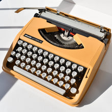 Load image into Gallery viewer, Olivetti Lettera 82 Orange Portable Typewriter

