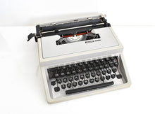 Load image into Gallery viewer, Olivetti Dora, UNCOMMON Techno cubic typeface
