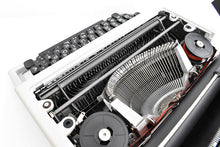 Load image into Gallery viewer, Olivetti Dora, UNCOMMON Techno cubic typeface
